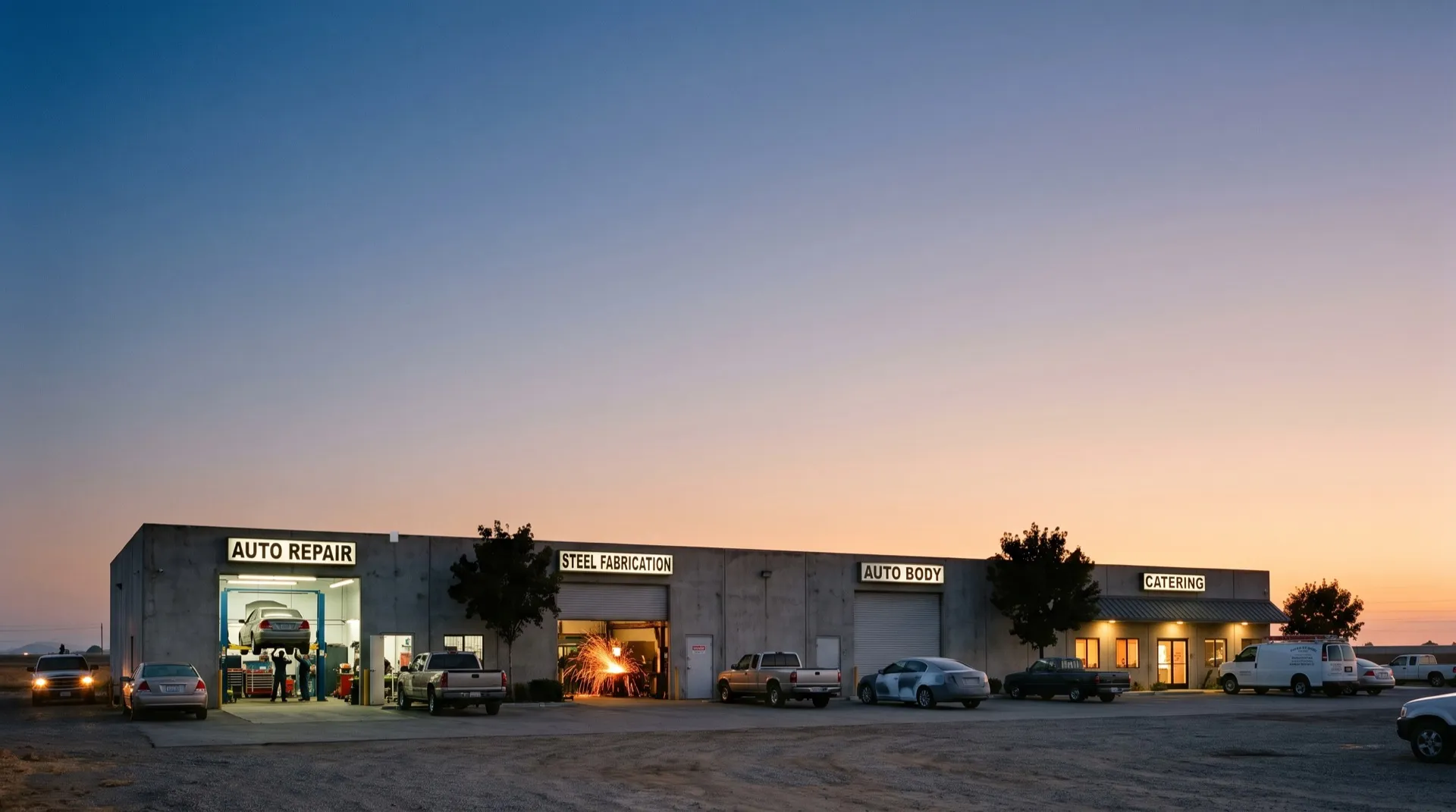 A row of shops at dusk with a small receiver on the roof edge